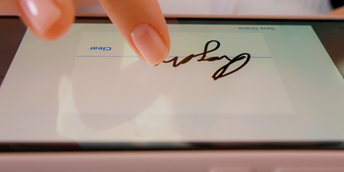 macro-digital-signature-smartphone-screen-with-finger